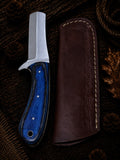 Fixed blade cleaver knife with blue and black layered wood handle and embossed leather sheath